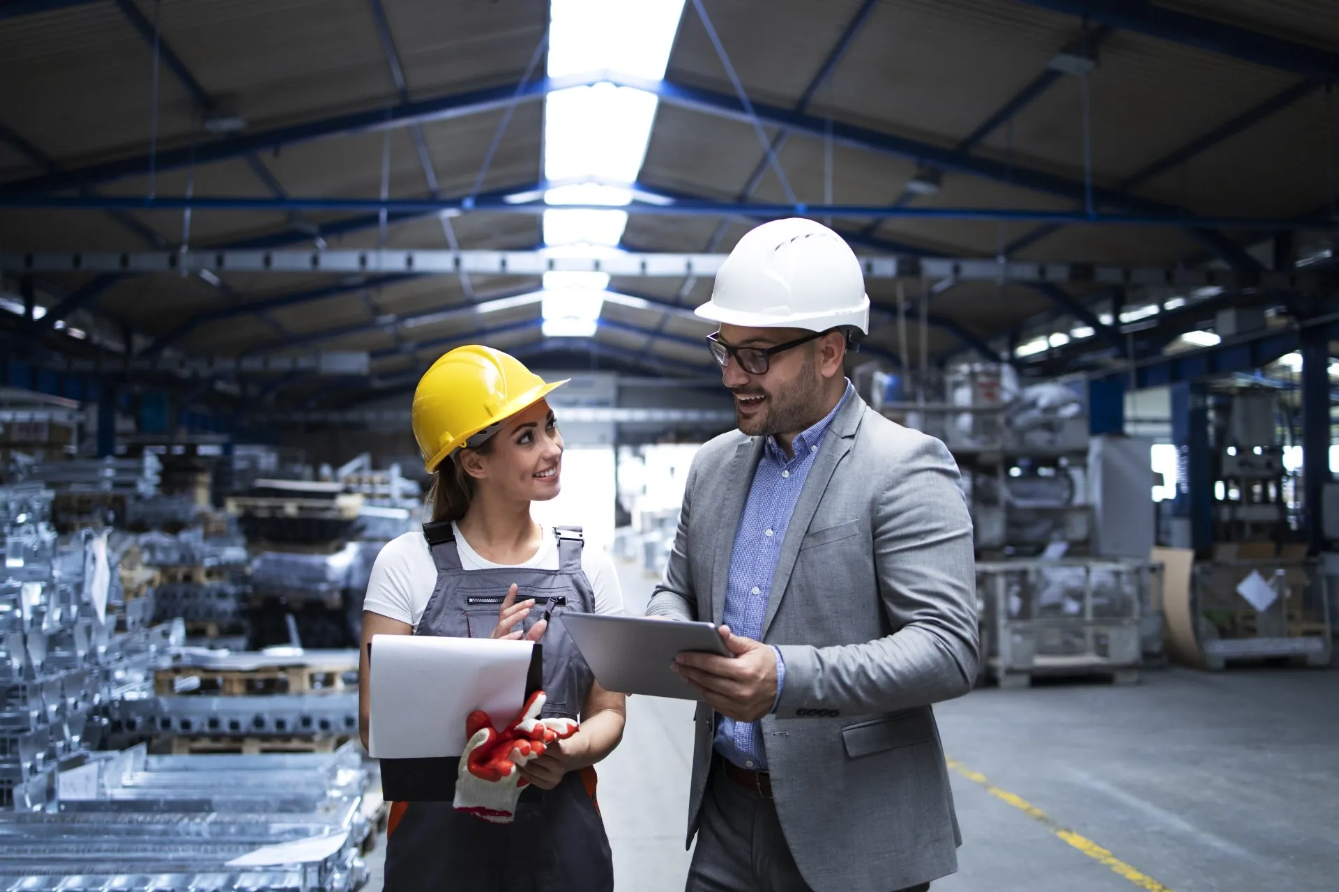 manager supervisor and worker discussing about production results and new strategy in factory industrial hall 1920w